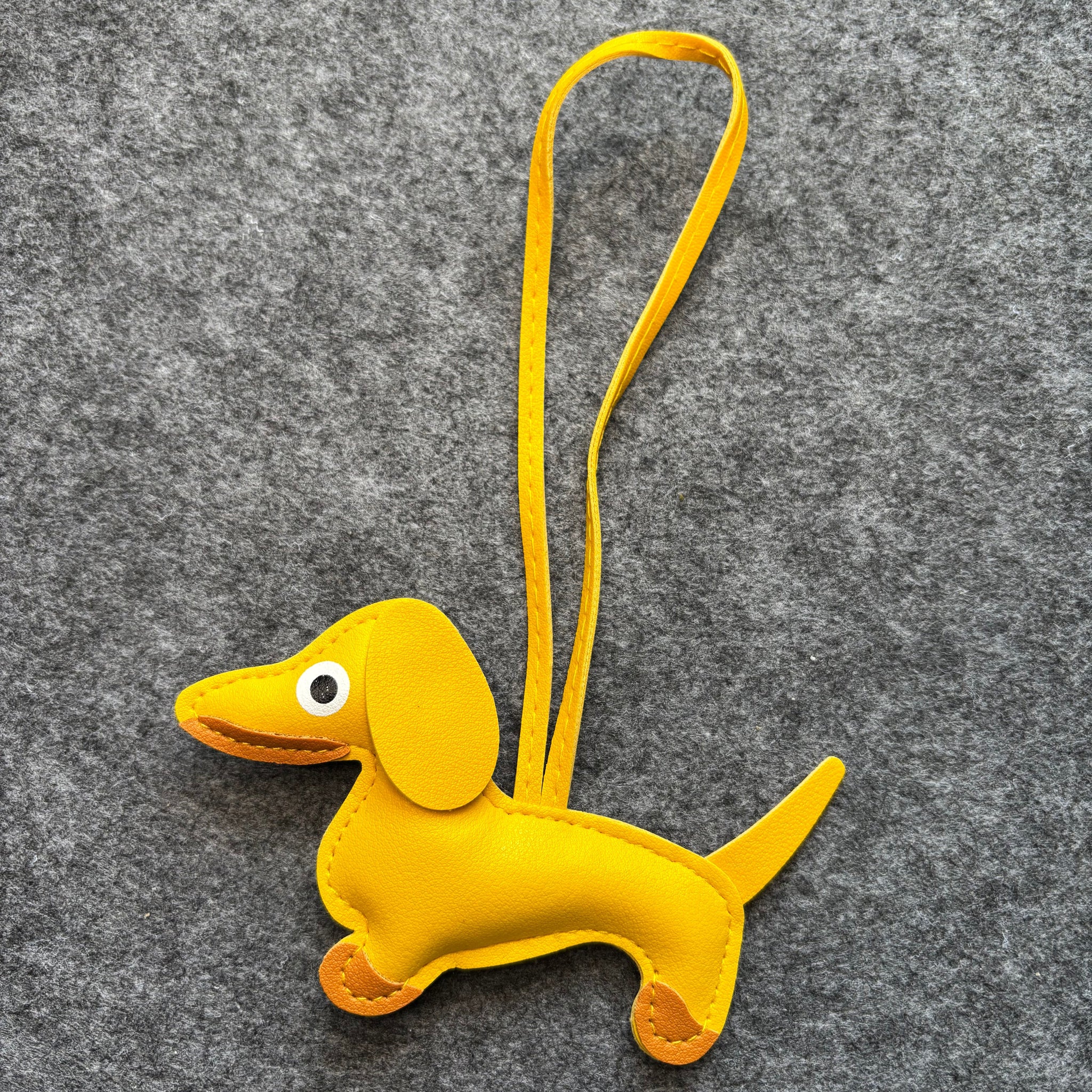 Väsksmycke i PU läder: Tax Nyckelring